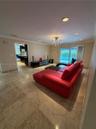 Recessed lighting, crown molding, and large format tile flooring