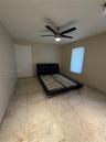 Recessed lighting, ceiling fan with integrated lighting, tiled flooring, window with blinds