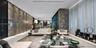 Expansive interior space featuring a large-scale natural stone wall, polished stone flooring, floor-to-ceiling sheer drapery, and recessed linear ligh