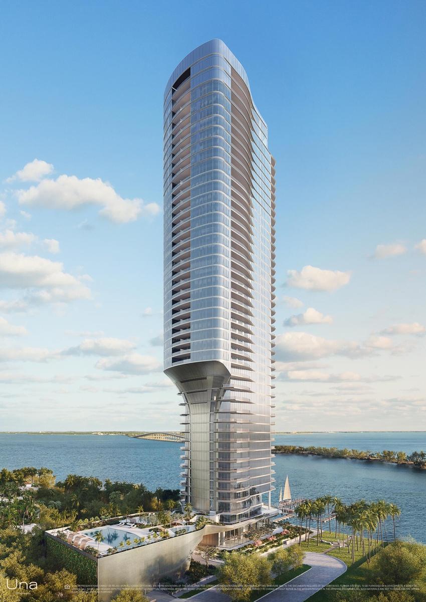 UNA Residences exterior building with water views.