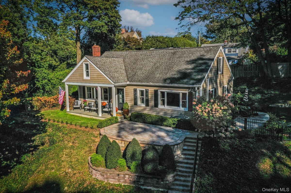 Beautiful cape with porch area and patios.