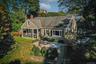 Beautiful cape with porch area and patios.