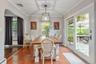 Sunny dining room with sliders out to the gardens.