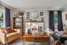 Cozy living room with wood burning stove and views to the porch.