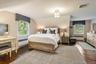 Large primary bedroom with extra space.