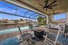 Beautiful details throughout this build. From the wood ceilings in the lanai, to the picture window screen cage with amazing views