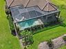 Drone view of backyard, Saltwater Pool & Spa w/ screen enclosure
