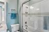 Bedroom 2 -en-suite bathroom w/ tub and glass shower doors