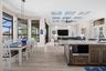 The kitchen overlooks the indoor and outdoor living areas