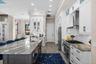 Granite tops and lots of cabinets in this well planned kitchen