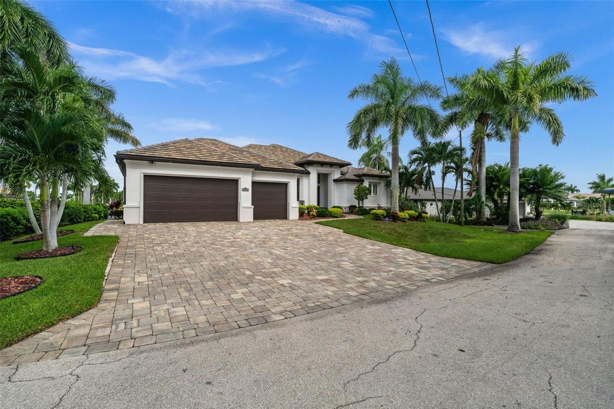 Beautiful Paver driveway leads to the 3 car garage