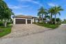 Beautiful Paver driveway leads to the 3 car garage