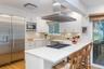 Chefs kitchen with stainless appliances and lots of storage space.