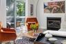 Living room with wood burning fireplace.
