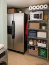 Stainless steel side-by-side refrigerator with exterior ice and water dispenser
