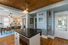 This angle of the kitchen shows the side door to front porch.