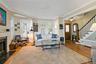 Intimate turret reading nook in the living room. Double door front entry way.