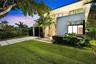 Modern two-story architectural exterior featuring smooth stucco finish, expansive glass windows, an upper-level balcony with metal railing, and a conc