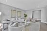 Living area featuring wood-finish flooring, recessed lighting, and a recessed architectural alcove