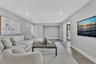 Living area featuring wood-finish flooring, recessed lighting, and a recessed wall niche