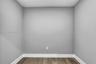 Neutral-toned walls and wood-finish flooring