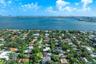 Aerial perspective featuring proximity to the waterfront and expansive maritime surroundings