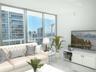 Floor-to-ceiling glass wall, urban cityscape, sliding glass door, balcony, and smooth-finish flooring
