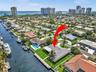 Waterfront property featuring a private boat dock, rectangular swimming pool, and concrete-tile roofing
