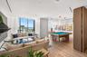 Open-concept interior featuring floor-to-ceiling windows, wood-finish flooring, recessed lighting, and custom built-in cabinetry