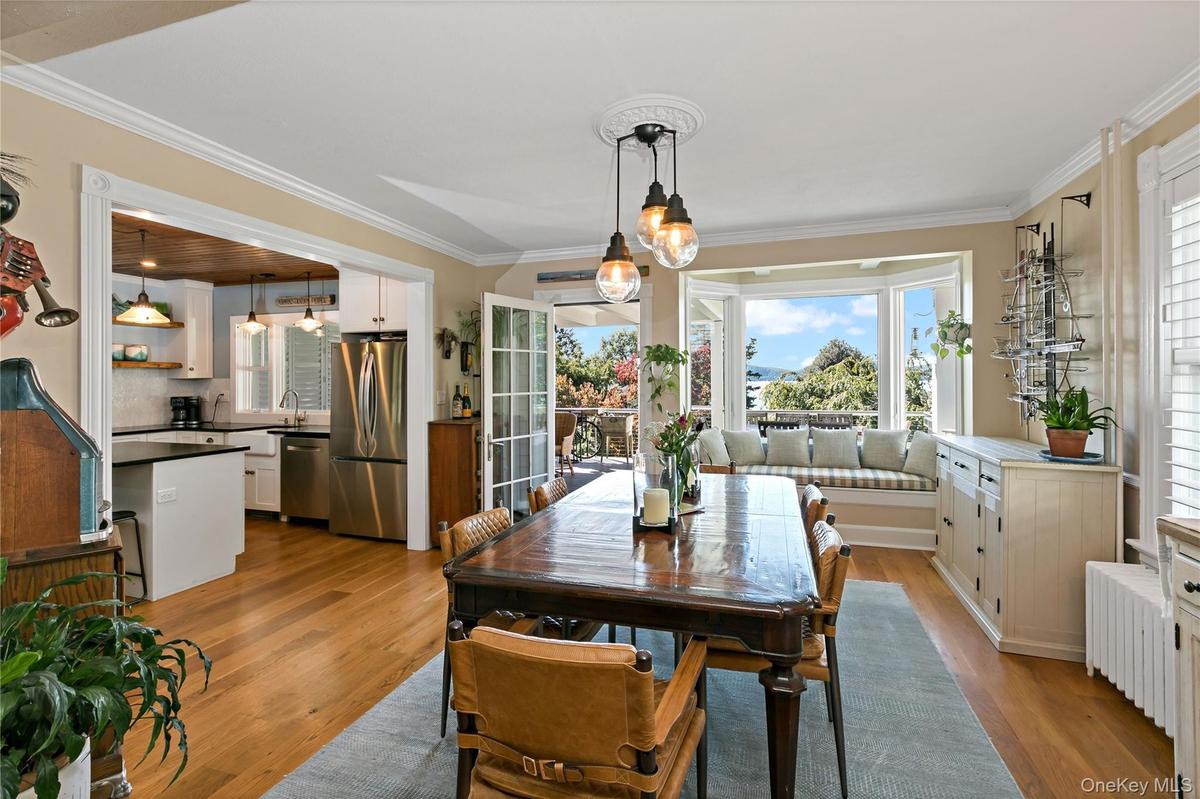 Formal dining room with custom window seat and dramatic views.
