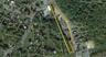 Aerial view of property's location featuring property parcel outlined