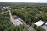 View of property location featuring a forest