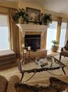 Decorative fireplace with a carved mantel and stone surround