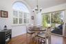 Dining Room Open to Kitchen and Living Room. Glass Sliders to the Patio