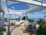 Expansive outdoor deck featuring wood-finish flooring