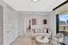 Light wood-finish flooring, recessed ceiling lighting, a louvered door, a full-height glass sliding door, and a private balcony with city scenery