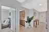 Recessed ceiling lighting, wood-finish flooring, white walls, and a contemporary bathroom vanity with a rectangular mirror