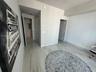 Polished stone-finish flooring with neutral veining, textured accent wall, and dual interior doorways