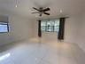 Large-format tile flooring, recessed ceiling lighting, and a multi-blade ceiling fan with integrated light fixture