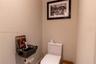 White dual-flush toilet featuring a sleek, minimalist profile