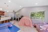Vaulted ceilings, tile flooring, recessed lighting, pendant lighting, and horizontal window blinds
