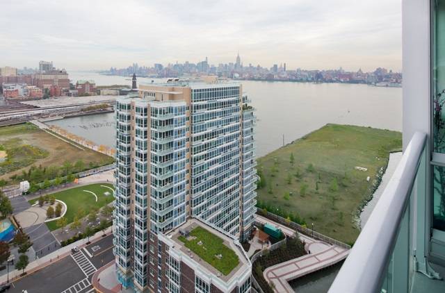 Upgrades abound in this lovely southeast facing unit with private balcony and superb NYC views