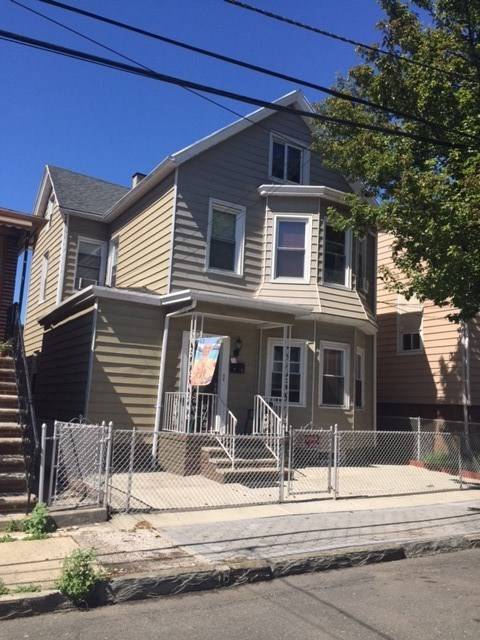 Beautifully kept 2 family house with finished Basement in North Bergen features living room