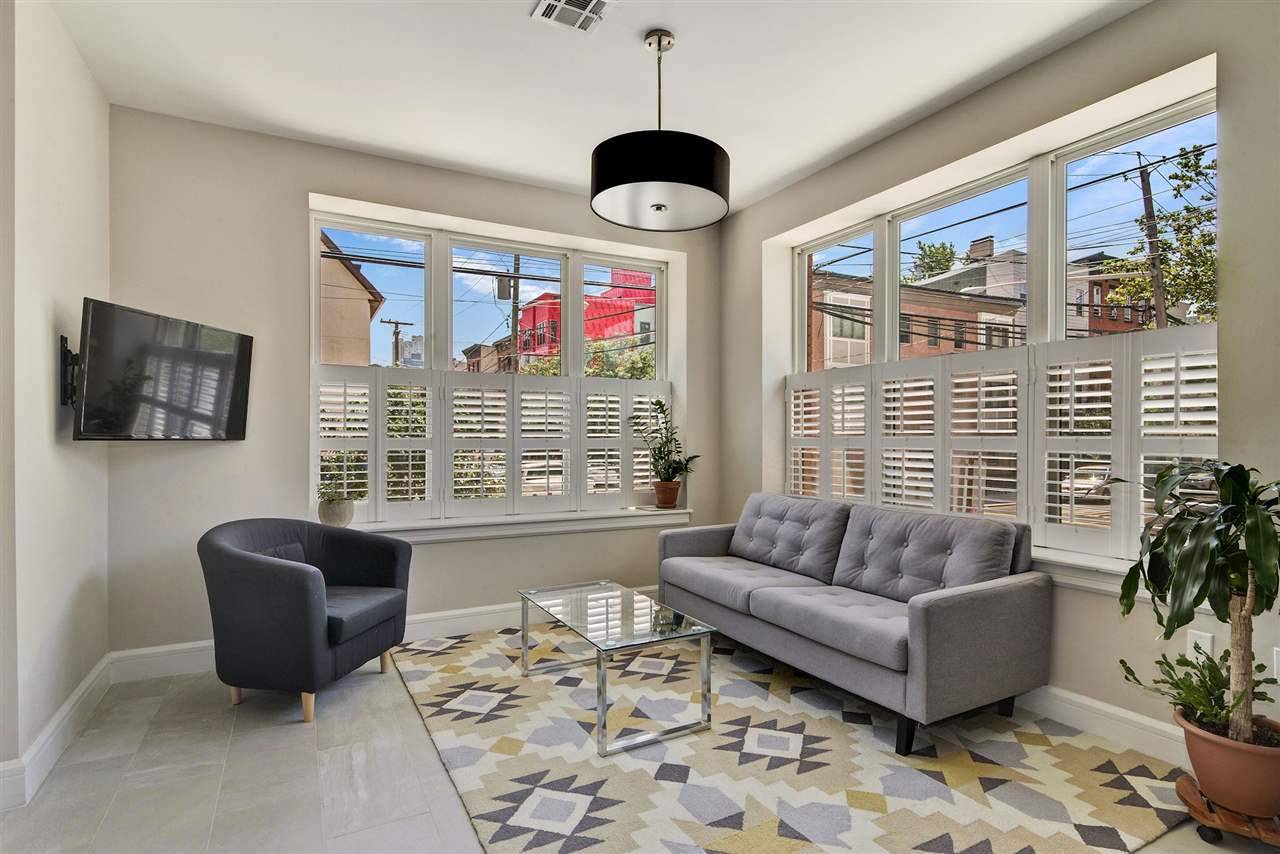 Welcome to this rarely available corner beauty: a 3br/3bath condo home in Downtown's historic Hamilton Park neighborhood