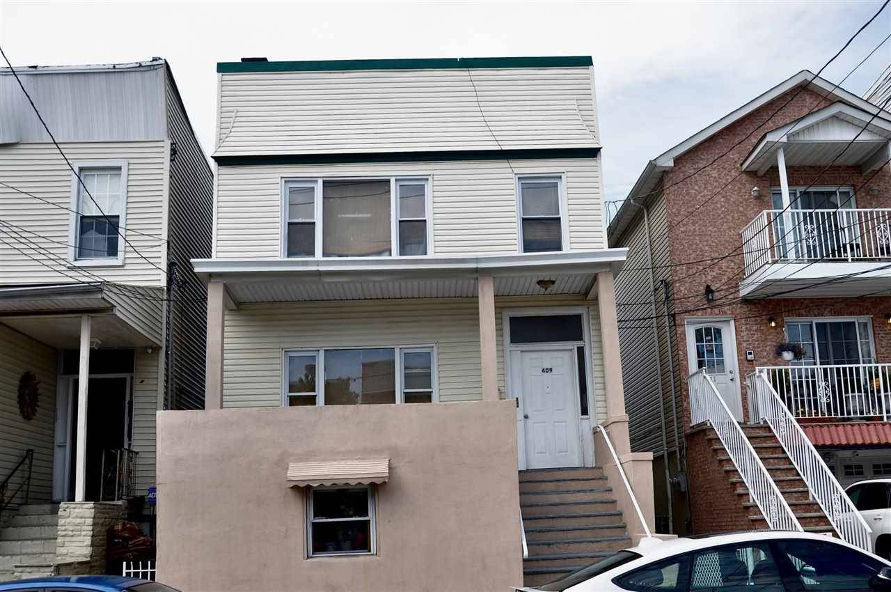 GREAT 3 FAMILY HOUSE WITH A BONUS APT REAR OFTHE PROPERTY EXCELLENT INVESTMENT FOR INVESTOR OR OWNER OCCUPY CLOSE TO NYC BUS SHOPPING AREA