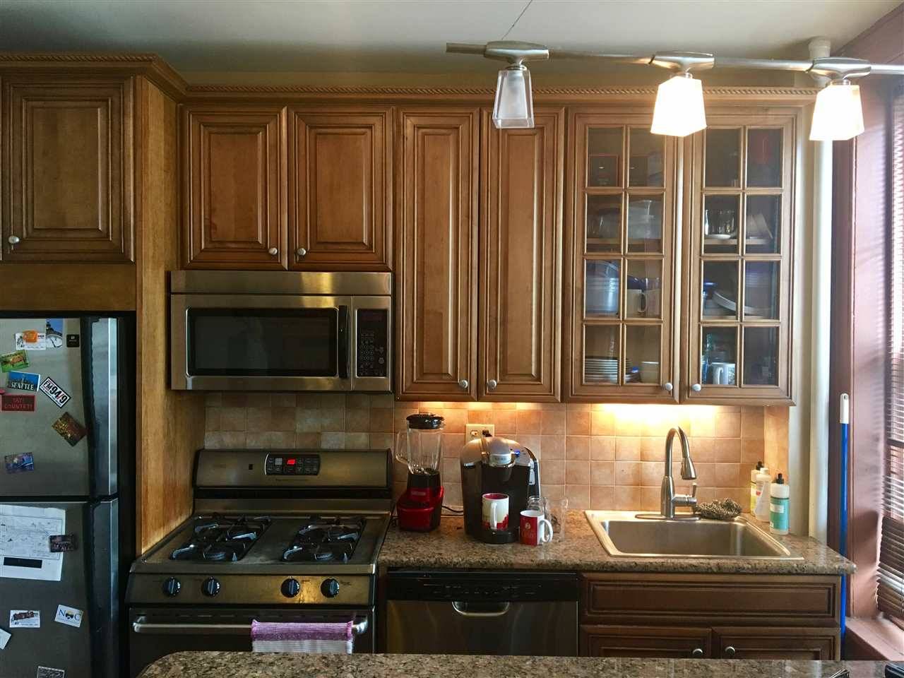 Kitchen has granite counters and breakfast bar - New Jersey