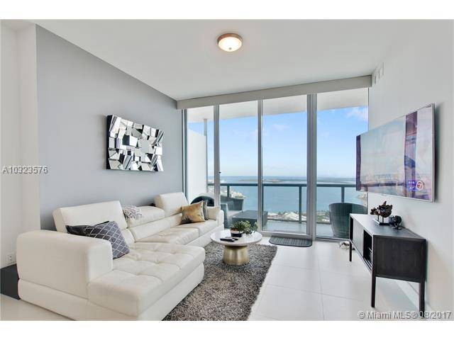 This spectacular sub-penthouse 2 bedroom luxury condo has miles of horizon views in all directions