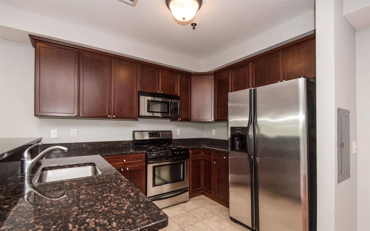 Incredible Sundrenched Corner Two Bedroom plus Den (works exceptionally as a 3rd Bedroom) 1382 sqft home offers views of Freedom Tower in every room