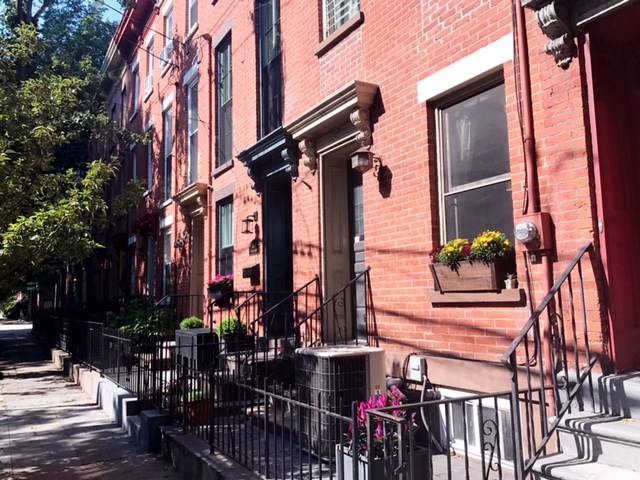 An opportunity to own a historic brownstone row house one block to Hamilton Park