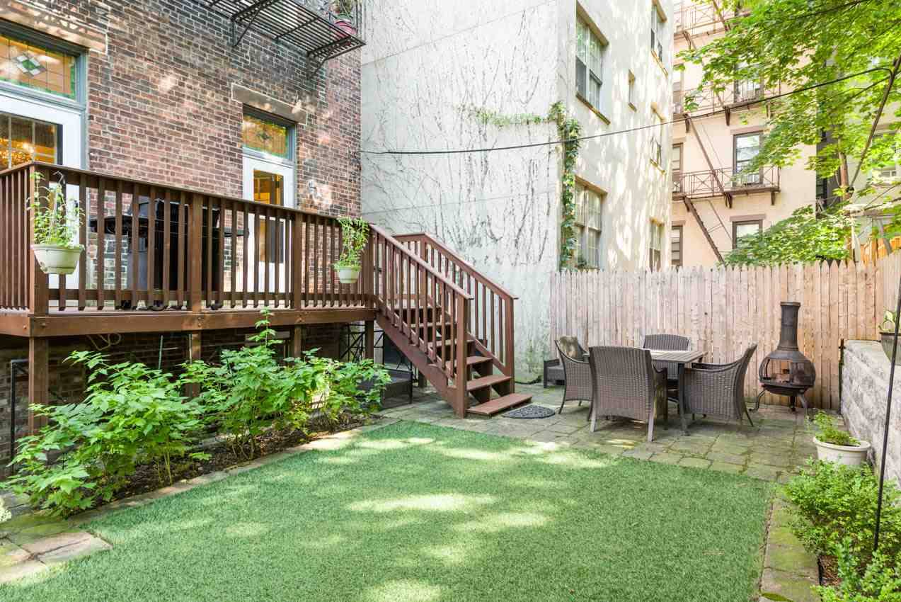 This bright and remarkably beautiful duplex home with a private deck (grill included